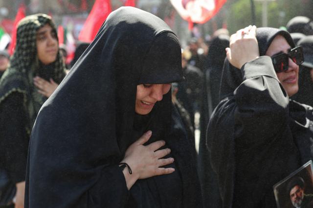 Mourners grieve as they gather to pray for Iran's slain supreme leader Ayatollah Ali Khamenei during the second day of funeral ceremonies at the Grand Mosalla in Tehran on July 5, 2026. Prayers were held July 5 over the casket of Iran's late supreme leader Ali Khamenei, the second day of funeral ceremonies that have drawn huge crowds to pay their final respects in Tehran. Khamenei ruled the Islamic republic from 1989 until he was killed aged 86 in an airstrike on the first day of the US-Israeli war with Iran on February 28. (Photo by AFP) / 
