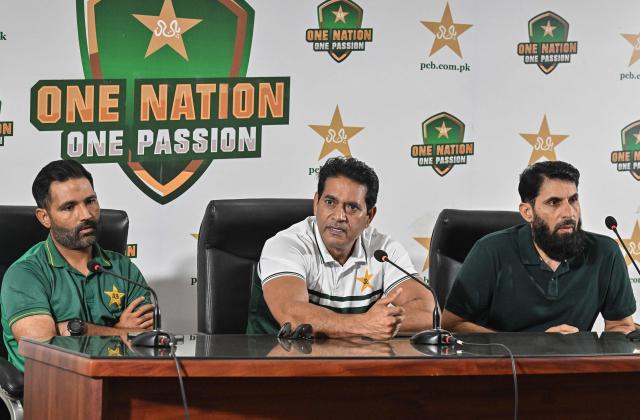 Pakistan national cricket selection committee members Aaqib Javed (C), Asad Shafiq (L) and Misbah-ul-Haq attend a press conference in Lahore on July 5, 2026. Pakistan on July 5 replaced struggling Test captain Shan Masood with Babar Azam, who will start a third stint as skipper on the tours of the West Indies and England starting later this month. (Photo by Arif ALI / AFP)