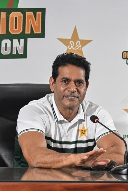 Pakistan national cricket selection committee member Aaqib Javed addresses a press conference in Lahore on July 5, 2026. Pakistan on July 5 replaced struggling Test captain Shan Masood with Babar Azam, who will start a third stint as skipper on the tours of the West Indies and England starting later this month. (Photo by Arif ALI / AFP)