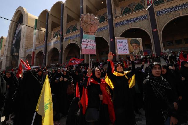 Mourners react as they pay their respects at the Grand Mosalla where they gathered to pray for Iran's slain supreme leader Ayatollah Ali Khamenei during the second day of funeral ceremonies in Tehran on July 5, 2026. Prayers were held July 5 over the casket of Iran's late supreme leader Ali Khamenei, the second day of funeral ceremonies that have drawn huge crowds to pay their final respects in Tehran. Khamenei ruled the Islamic republic from 1989 until he was killed aged 86 in an airstrike on the first day of the US-Israeli war with Iran on February 28. (Photo by ATTA KENARE / AFP) / 