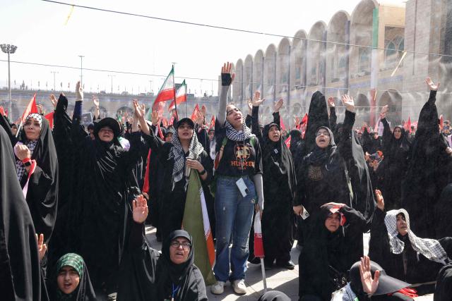Mourners react as they pay their respects at the Grand Mosalla where they gathered to pray for Iran's slain supreme leader Ayatollah Ali Khamenei during the second day of funeral ceremonies in Tehran on July 5, 2026. Prayers were held July 5 over the casket of Iran's late supreme leader Ali Khamenei, the second day of funeral ceremonies that have drawn huge crowds to pay their final respects in Tehran. Khamenei ruled the Islamic republic from 1989 until he was killed aged 86 in an airstrike on the first day of the US-Israeli war with Iran on February 28. (Photo by ATTA KENARE / AFP) / 