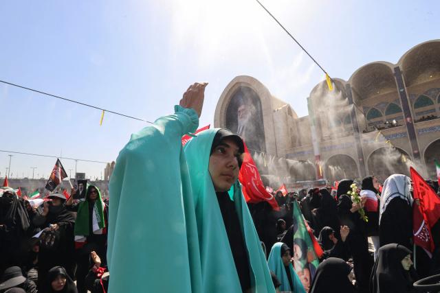A mourner reacts as she pays respect at the Grand Mosalla where people gathered to pray for Iran's slain supreme leader Ayatollah Ali Khamenei during the second day of funeral ceremonies in Tehran on July 5, 2026. Prayers were held July 5 over the casket of Iran's late supreme leader Ali Khamenei, the second day of funeral ceremonies that have drawn huge crowds to pay their final respects in Tehran. Khamenei ruled the Islamic republic from 1989 until he was killed aged 86 in an airstrike on the first day of the US-Israeli war with Iran on February 28. (Photo by ATTA KENARE / AFP) / 