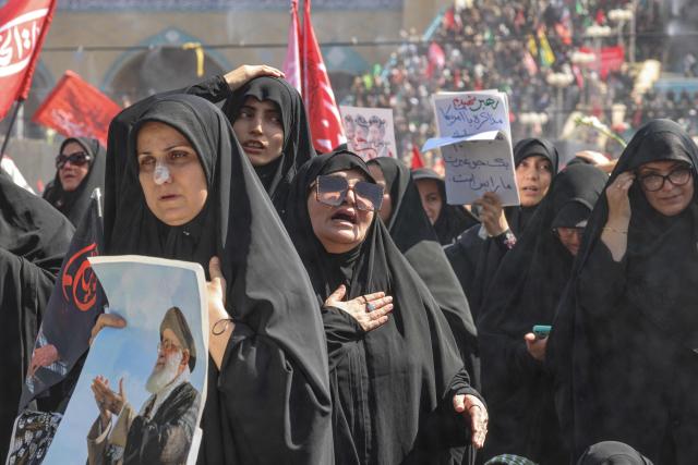 Mourners react as they pay their respects at the Grand Mosalla where they gathered to pray for Iran's slain supreme leader Ayatollah Ali Khamenei during the second day of funeral ceremonies in Tehran on July 5, 2026. Prayers were held July 5 over the casket of Iran's late supreme leader Ali Khamenei, the second day of funeral ceremonies that have drawn huge crowds to pay their final respects in Tehran. Khamenei ruled the Islamic republic from 1989 until he was killed aged 86 in an airstrike on the first day of the US-Israeli war with Iran on February 28. (Photo by ATTA KENARE / AFP) / 