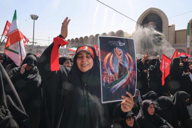 Mourners react as they pay their respects at the Grand Mosalla where they gathered to pray for Iran's slain supreme leader Ayatollah Ali Khamenei during the second day of funeral ceremonies in Tehran on July 5, 2026. Prayers were held July 5 over the casket of Iran's late supreme leader Ali Khamenei, the second day of funeral ceremonies that have drawn huge crowds to pay their final respects in Tehran. Khamenei ruled the Islamic republic from 1989 until he was killed aged 86 in an airstrike on the first day of the US-Israeli war with Iran on February 28. (Photo by ATTA KENARE / AFP) / 