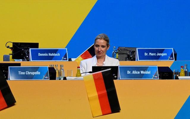 The co-leader of the far-right Alternative for Germany (AfD) party Alice Weidel sits alone on stage on the second day of the party congress of far-right Alternative for Germany (AfD) at the Messe Erfurt fairground in Erfurt, eastern Germany on July 5, 2026.  (Photo by John MACDOUGALL / AFP)