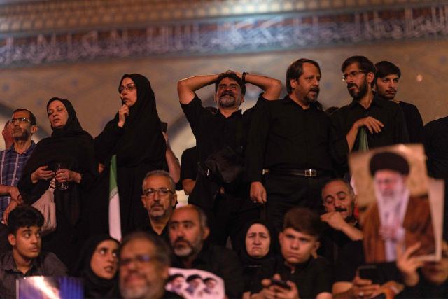 People gather to mourn Iran's slain supreme leader Ayatollah Ali Khamenei during the funeral ceremonies at the Grand Mosalla in Tehran early on July 5, 2026. Iranian leaders on July 5 joined prayers over the casket of late supreme leader Ali Khamenei during a second day of funeral ceremonies, which was declared a public holiday across Iran. Khamenei's body will be moved out of the Grand Mosalla later in the day, where it is lying in state, as part of preparations for processions through the capital the following day. (Photo by AFP) / 