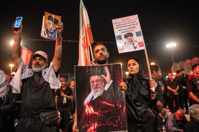 People gather to mourn Iran's slain supreme leader Ayatollah Ali Khamenei during the funeral ceremonies at the Grand Mosalla in Tehran early on July 5, 2026. Iranian leaders on July 5 joined prayers over the casket of late supreme leader Ali Khamenei during a second day of funeral ceremonies, which was declared a public holiday across Iran. Khamenei's body will be moved out of the Grand Mosalla later in the day, where it is lying in state, as part of preparations for processions through the capital the following day. (Photo by AFP) / 