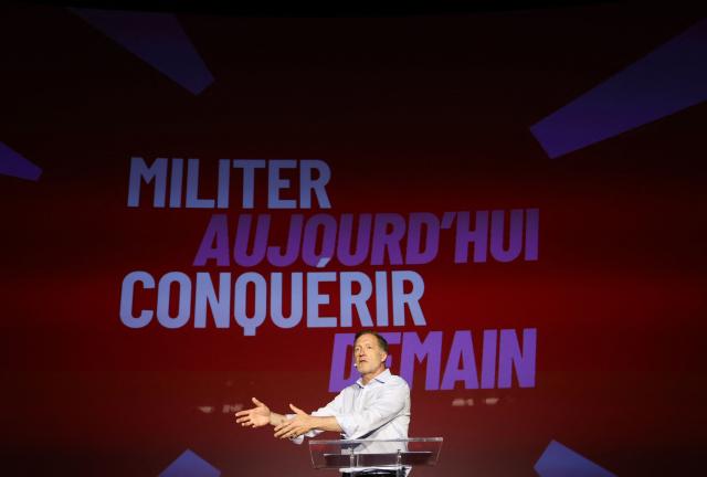 President of the Belgian French-speaking left-wing Socialist Party (PS) Paul Magnette gestures as he delivers a speech on stage during the Belgian French-speaking Socialist Party congress in Namur, on July 5, 2026. (Photo by VIRGINIE LEFOUR / Belga / AFP) / Belgium OUT