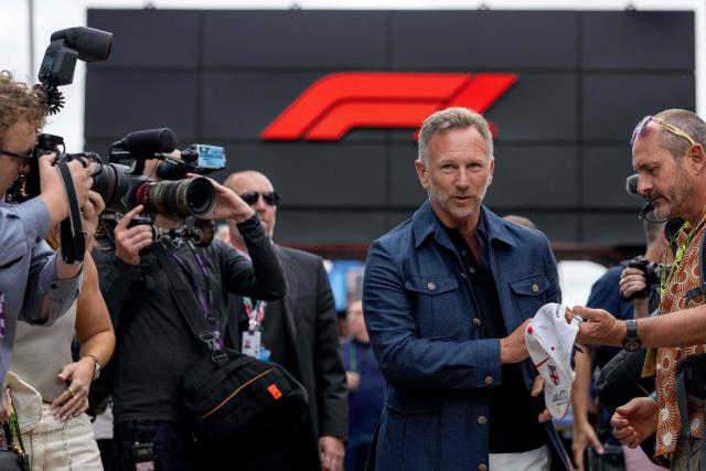Former Red Bull Racing team principal Christian Horner (centre R) arrives in the paddock ahead of the Formula One British Grand Prix at the Silverstone motor racing circuit in Silverstone, central England, on July 5, 2026. (Photo by Ben STANSALL / AFP)