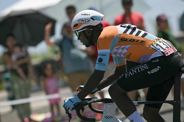 NSN Cycling Team's Eritrean rider Biniam Girmay cycles after a crash during the 2nd stage of the 113th edition of the Tour de France cycling race, 168,5 km between Tarragona and Barcelona in northeastern Spain, on July 5, 2026. (Photo by Loic VENANCE / AFP)