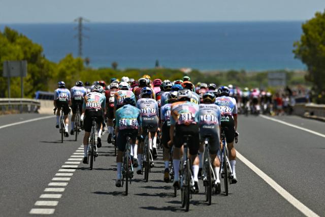 The pack of riders (peloton) cycles towards the Mediterranean coastline during the 2nd stage of the 113th edition of the Tour de France cycling race, 168,5 km between Tarragona and Barcelona in northeastern Spain, on July 5, 2026. (Photo by Loic VENANCE / AFP)
