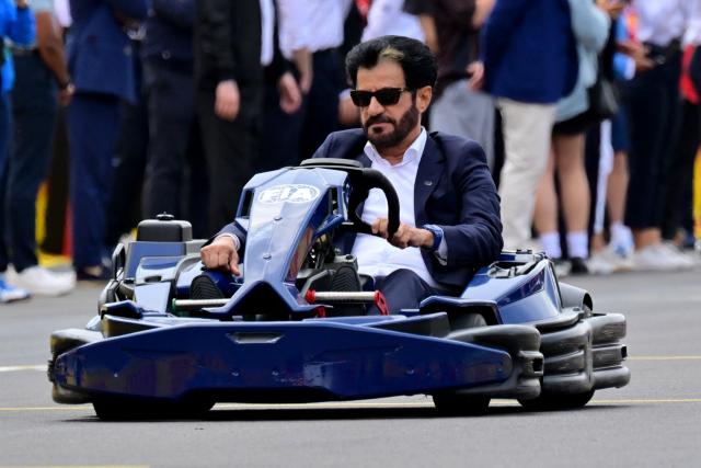 FIA President Mohammed Ben Sulayem drives a Lego minicar during the drivers parade ahead of the Formula One British Grand Prix at the Silverstone motor racing circuit in Silverstone, central England, on July 5, 2026. (Photo by Andrej ISAKOVIC / AFP)
