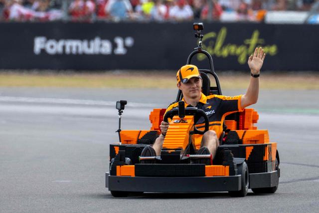 McLaren's Australian driver Oscar Piastri drives a Lego F1 minicart during the drivers parade ahead of the Formula One British Grand Prix at the Silverstone motor racing circuit in Silverstone, central England, on July 5, 2026. (Photo by Ben STANSALL / AFP)