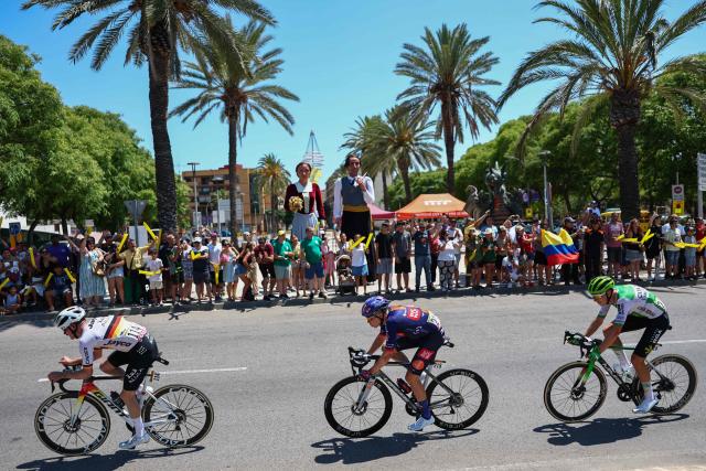 Team Jayco AlUla's German rider Felix Engelhardt (L), Team Picnic PostNL's Dutch rider Frank van den Broek (C) and Caja Rural - Seguros RGA team's Dutch rider Alex Molenaar (R) cycle in a breakaway during the 2nd stage of the 113th edition of the Tour de France cycling race, 168,5 km between Tarragona and Barcelona in northeastern Spain, on July 5, 2026. (Photo by Anne-Christine POUJOULAT / AFP)