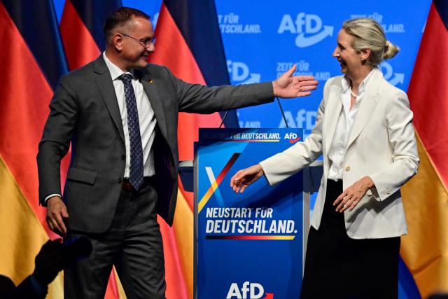 AfD co-leader Alice Weidel (R) reacts with co-leader Tino Chrupalla after her final speech at the end of the party congress of far-right Alternative for Germany (AfD) at the Messe Erfurt fairground in Erfurt, eastern Germany on July 5, 2026.  (Photo by John MACDOUGALL / AFP)