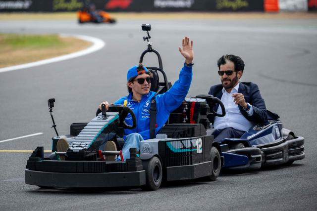 Mercedes' Italian driver Kimi Antonelli (L) and FIA President Mohammed Ben Sulayem drive Lego F1 minicarts during the drivers parade ahead of the Formula One British Grand Prix at the Silverstone motor racing circuit in Silverstone, central England, on July 5, 2026. (Photo by Ben STANSALL / AFP)
