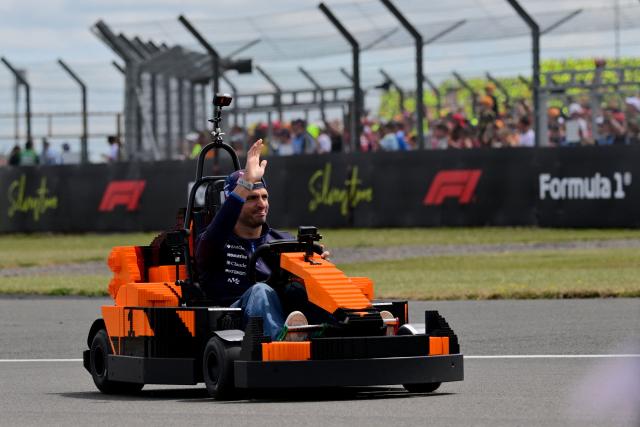 Williams' Spanish driver Carlos Sainz drives a Lego minicar during the drivers parade ahead of the Formula One British Grand Prix at the Silverstone motor racing circuit in Silverstone, central England, on July 5, 2026. (Photo by Andrej ISAKOVIC / AFP)