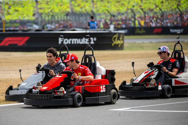Audi's Brazilian driver Gabriel Bortoleto (L) Ferrari's Monegasque driver Charles Leclerc (C) and Haas F1 Team's British driver Oliver Bearman (R) drive Lego F1 minicarts during the drivers parade ahead of the Formula One British Grand Prix at the Silverstone motor racing circuit in Silverstone, central England, on July 5, 2026. (Photo by Ben STANSALL / AFP)