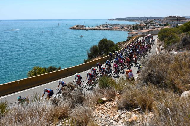 TOPSHOT - The pack of riders (peloton) cycles along the Mediterranean coastline near Sitges during the 2nd stage of the 113th edition of the Tour de France cycling race, 168,5 km between Tarragona and Barcelona in northeastern Spain, on July 5, 2026. (Photo by Anne-Christine POUJOULAT / AFP)