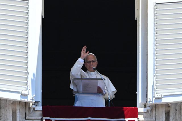 Pope Leo XIV blesses the crowd as he leads an Angelus prayer from the window of the apostolic palace overlooking St. Peter's square in The Vatican on July 5, 2026. (Photo by Andreas SOLARO / AFP)