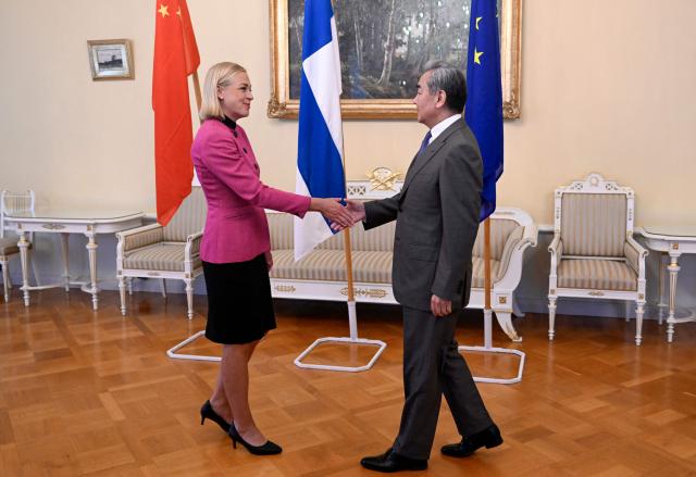 Finnish Foreign Minister Elina Valtonen (L) welcomes Chinese Foreign Minister Wang Yi as they meet in Helsinki, Finland, on July 5, 2026. Chinese Foreign Minister Wang Yi is currently touring the Nordic countries. (Photo by Jade Silpo / Lehtikuva / AFP) / Finland OUT