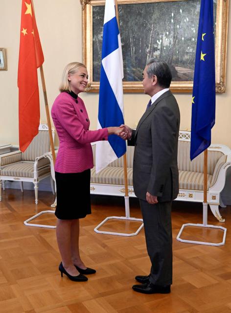 Finnish Foreign Minister Elina Valtonen (L) welcomes Chinese Foreign Minister Wang Yi as they meet in Helsinki, Finland, on July 5, 2026. Chinese Foreign Minister Wang Yi is currently touring the Nordic countries. (Photo by Jade Silpo / Lehtikuva / AFP) / Finland OUT