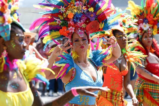 A reveller takes part in the Paris Tropical Carnival in Paris on July 5, 2026. (Photo by ROMAIN PERROCHEAU / AFP)