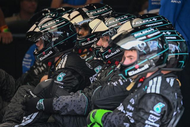 Mechanics for the team of Mercedes' Italian driver Kimi Antonelli are pictured in the garage during the Formula One British Grand Prix at the Silverstone motor racing circuit in Silverstone, central England, on July 5, 2026. (Photo by PETER POWELL / POOL / AFP)