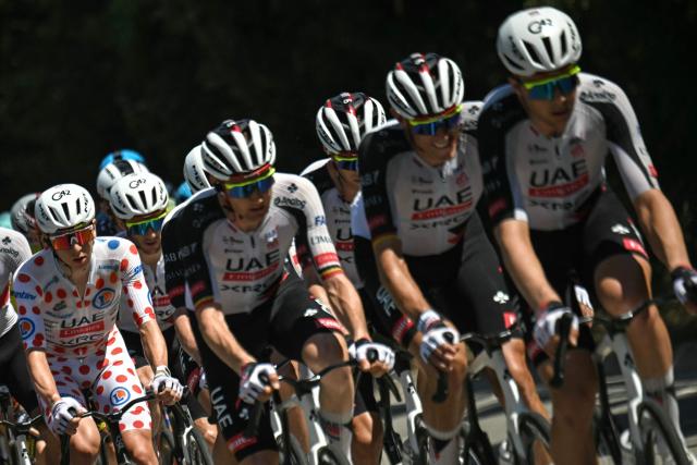 UAE Team Emirates - XRG's Slovenian rider Tadej Pogacar wearing the climber's dotted jersey (L) cycles with his team in the pack of riders (peloton) during the 2nd stage of the 113th edition of the Tour de France cycling race, 168,5 km between Tarragona and Barcelona in northeastern Spain, on July 5, 2026. (Photo by Loic VENANCE / AFP)
