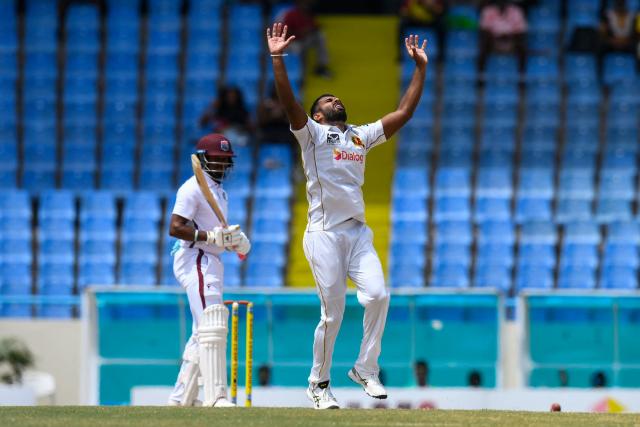 Isitha Wijesundara (R) of Sri Lanka expresses disappointment that Kavem Hodge (L) of West Indies was not bowled during the third day of the second Test cricket match between West Indies and Sri Lanka at Sir Vivian Richards Stadium in North Sound, Antigua and Barbuda, on July 5, 2026. (Photo by Randy Brooks / AFP)