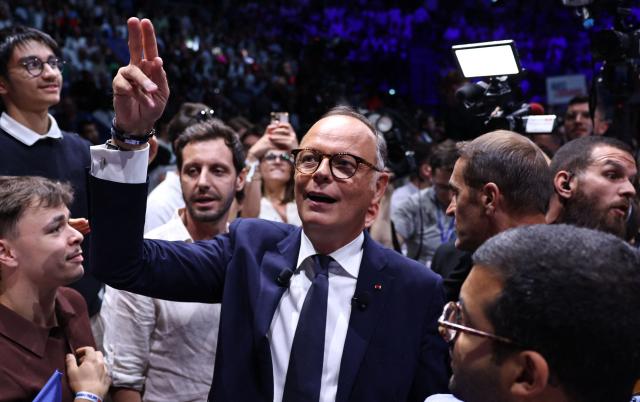 French right-wing party Horizons founder and president, mayor of Le Havre and candidate for the 2027 French presidential election Edouard Philippe (C) reacts at the end of his presidential election campaign rally at the Adidas Arena, in northern Paris on July 5, 2026. (Photo by SIMON WOHLFAHRT / AFP)