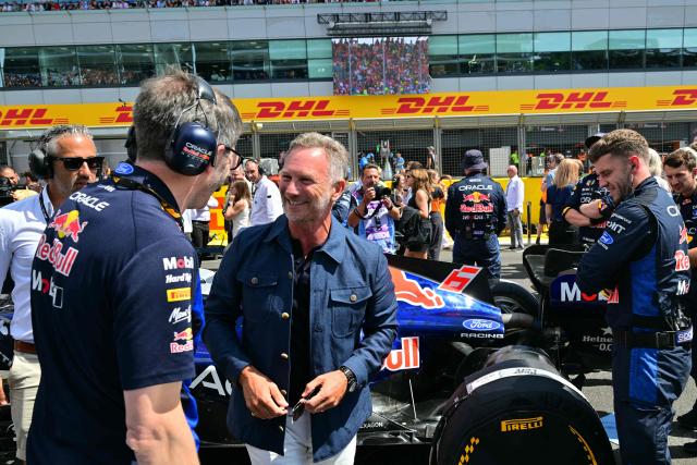 Former Red Bull Racing team principal Christian Horner (C) on the grid ahead of the start of the Formula One British Grand Prix at the Silverstone motor racing circuit in Silverstone, central England, on July 5, 2026. (Photo by Andrej ISAKOVIC / AFP)