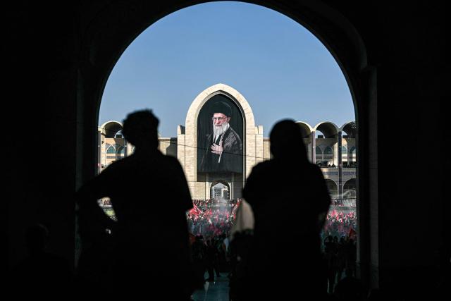 People gather to mourn Iran's slain supreme leader Ayatollah Ali Khamenei during the funeral ceremonies at the Grand Mosalla in Tehran on July 5, 2026. Iranian leaders on July 5 joined prayers over the casket of late supreme leader Ali Khamenei during a second day of funeral ceremonies, which was declared a public holiday across Iran. Khamenei's body will be moved out of the Grand Mosalla later in the day, where it is lying in state, as part of preparations for processions through the capital the following day. (Photo by Ozan KOSE / AFP) / 