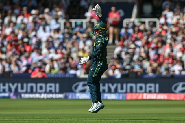 Australia's wicketkeeper Beth Mooney celebrates after dismissing England's Danni Wyatt-Hodge (not pictured) during the ICC Women's T20 cricket world cup 2026 final between Australia and England, at Lord's in London on July 5, 2026. (Photo by JUSTIN TALLIS / AFP)