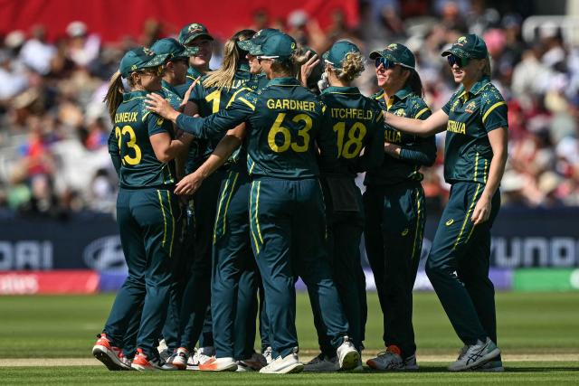 Australia celebrate after dismissing England's Danni Wyatt-Hodge (not pictured) during the ICC Women's T20 cricket world cup 2026 final between Australia and England, at Lord's in London on July 5, 2026. (Photo by JUSTIN TALLIS / AFP)