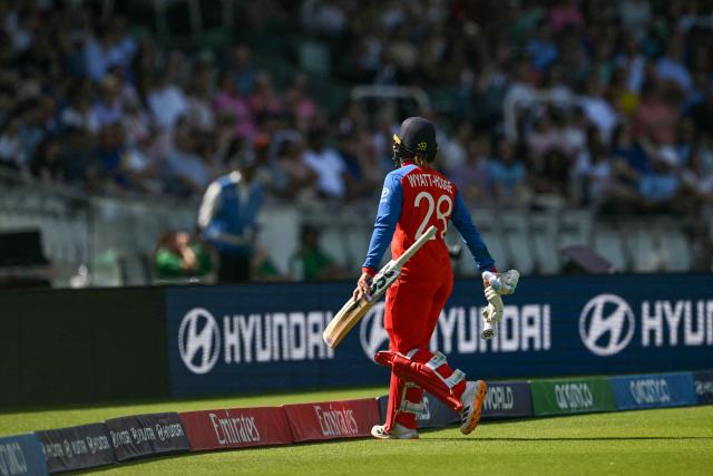 England's Danni Wyatt-Hodge walks off after being dismissed during the ICC Women's T20 cricket world cup 2026 final between Australia and England, at Lord's in London on July 5, 2026. (Photo by JUSTIN TALLIS / AFP)