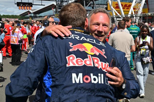 Former Red Bull Racing team principal Christian Horner (R) on the grid ahead of the start of the Formula One British Grand Prix at the Silverstone motor racing circuit in Silverstone, central England, on July 5, 2026. (Photo by Andrej ISAKOVIC / AFP)
