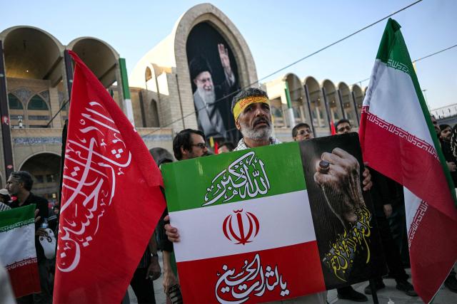 People gather to mourn Iran's slain supreme leader Ayatollah Ali Khamenei during the funeral ceremonies at the Grand Mosalla in Tehran on July 5, 2026. Iranian leaders on July 5 joined prayers over the casket of late supreme leader Ali Khamenei during a second day of funeral ceremonies, which was declared a public holiday across Iran. Khamenei's body will be moved out of the Grand Mosalla later in the day, where it is lying in state, as part of preparations for processions through the capital the following day. (Photo by Ozan KOSE / AFP) / 