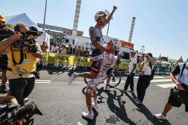 UAE Team Emirates - XRG's Slovenian rider Tadej Pogacar congratulates UAE Team Emirates - XRG's Mexican rider Isaac Del Toro after he won the 2nd stage of the 113th edition of the Tour de France cycling race, 168,5 km between Tarragona and Barcelona in northeastern Spain, on July 5, 2026. (Photo by Stephanie Lecocq / POOL / AFP)