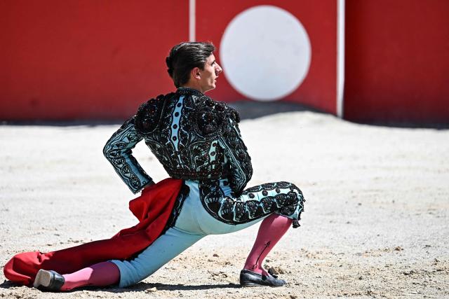 French novillero (novice bullfighter) Esteban Navarro faces a bull during a bullfight in the Feria of Boujan-sur-Libron, near Beziers, southern France on July 5, 2026. (Photo by Gabriel BOUYS / AFP)