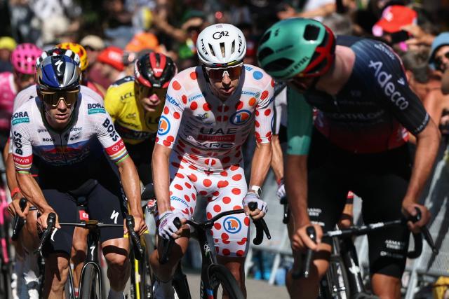 Red Bull - BORA - hansgrohe team's Belgian rider Remco Evenepoel and UAE Team Emirates - XRG's Slovenian rider Tadej Pogacar wearing the climber's dotted jersey cycle in the ascent of Montjuic Palace in the final kilometers during the 2nd stage of the 113th edition of the Tour de France cycling race, 168,5 km between Tarragona and Barcelona in northeastern Spain, on July 5, 2026. (Photo by Anne-Christine POUJOULAT / AFP)