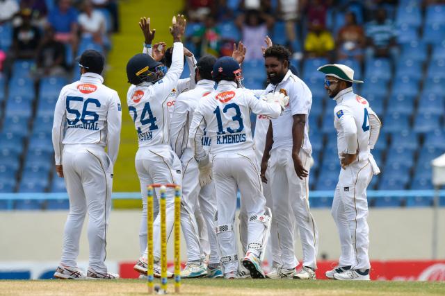 Prabath Jayasuriya (R) of Sri Lanka celebrates the dismissal of Amir Jangoo of West Indies during the 3rd day of the 2nd Test between Sri Lanka and West Indies at Vivian Richards Cricket Stadium in North Sound, Antigua and Barbuda, on July 5, 2026. (Photo by Randy Brooks / AFP)