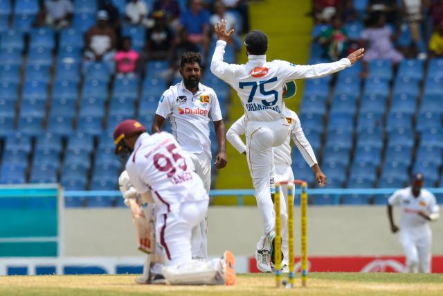 Prabath Jayasuriya (C) of Sri Lanka celebrates the dismissal of Amir Jangoo (L) of West Indies during the 3rd day of the 2nd Test between Sri Lanka and West Indies at Vivian Richards Cricket Stadium in North Sound, Antigua and Barbuda, on July 5, 2026. (Photo by Randy Brooks / AFP)