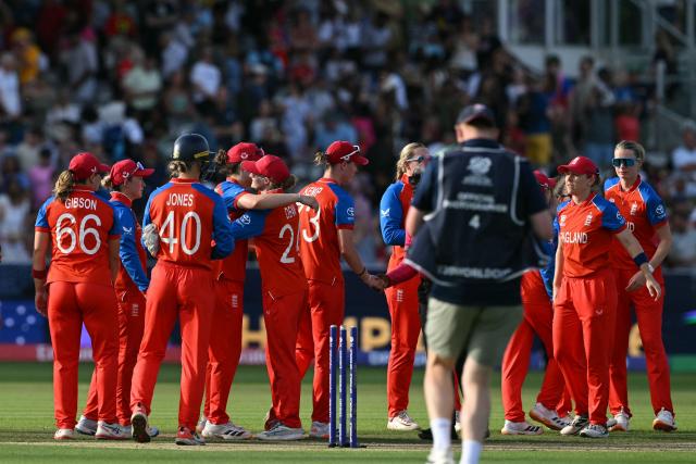 England's console themselves after their defeat in the ICC Women's T20 cricket world cup 2026 final between Australia and England, at Lord's in London on July 5, 2026. Australia thrashed England by seven wickets to win the Women's T20 World Cup final at Lord's on Sunday. Victory gave Australia a record-extending seventh Women's T20 global title as they chased down a target of 151 with 17 balls to spare. (Photo by JUSTIN TALLIS / AFP)