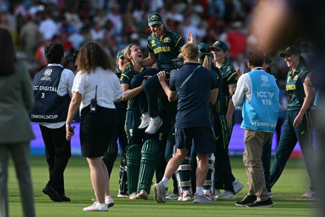 Australia's players celebrate beating England in the ICC Women's T20 cricket world cup 2026 final between Australia and England, at Lord's in London on July 5, 2026. Australia thrashed England by seven wickets to win the Women's T20 World Cup final at Lord's on Sunday. Victory gave Australia a record-extending seventh Women's T20 global title as they chased down a target of 151 with 17 balls to spare. (Photo by JUSTIN TALLIS / AFP)