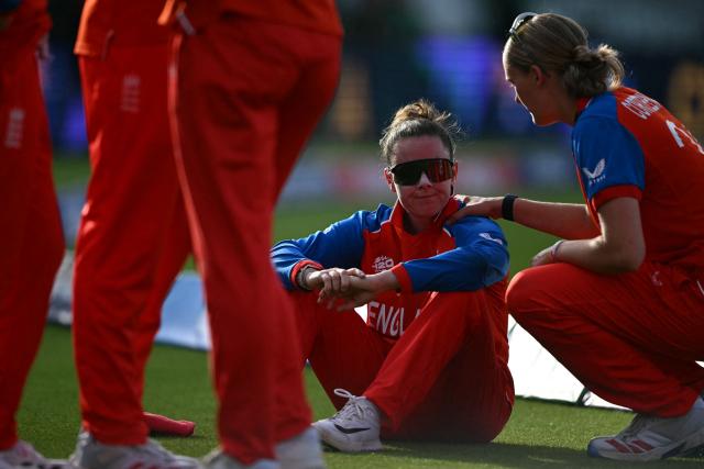England's Linsey Smith reacts to their defeat in the ICC Women's T20 cricket world cup 2026 final between Australia and England, at Lord's in London on July 5, 2026. Australia thrashed England by seven wickets to win the Women's T20 World Cup final at Lord's on Sunday. Victory gave Australia a record-extending seventh Women's T20 global title as they chased down a target of 151 with 17 balls to spare. (Photo by JUSTIN TALLIS / AFP)