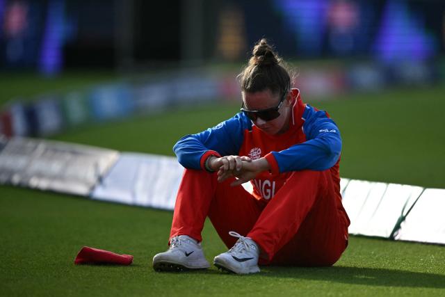 England's Linsey Smith reacts to their defeat in the ICC Women's T20 cricket world cup 2026 final between Australia and England, at Lord's in London on July 5, 2026. Australia thrashed England by seven wickets to win the Women's T20 World Cup final at Lord's on Sunday. Victory gave Australia a record-extending seventh Women's T20 global title as they chased down a target of 151 with 17 balls to spare. (Photo by JUSTIN TALLIS / AFP)