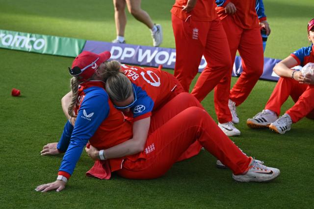 England's Sophie Ecclestone (L) and England's Lauren Bell (2L) react after their defeat in the ICC Women's T20 cricket world cup 2026 final between Australia and England, at Lord's in London on July 5, 2026. Australia thrashed England by seven wickets to win the Women's T20 World Cup final at Lord's on Sunday. Victory gave Australia a record-extending seventh Women's T20 global title as they chased down a target of 151 with 17 balls to spare. (Photo by JUSTIN TALLIS / AFP)