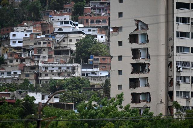 EDITORS NOTE: Graphic content / View of a damaged building in Macuto, Vargas state, Venezuela, on July 5, 2026, following the June 24 twin earthquakes. The devastating earthquakes that struck Venezuela eleven days ago have now claimed nearly 3,000 lives, according to the latest figures released on July 4, 2026, as foreign rescue teams wind down their operations to find survivors. (Photo by Raul ARBOLEDA / AFP)