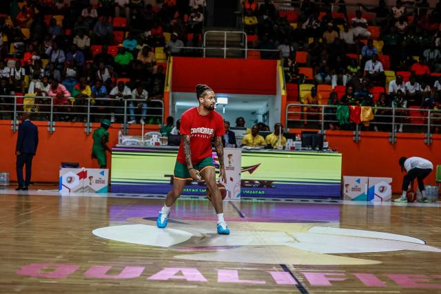 Cameroon's #68 Jeremiah Hill warms up before a basketball match game between Cameron vs South Soudan played on the third day of the African qualifying for the 2027 Men's Basketball World Cup in Qatar, in Douala on July 5, 2026. (Photo by Daniel BELOUMOU OLOMO / AFP)